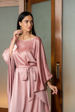 Sunshade kaftan with a romantic notion embellished with organza flowers on the side. A fabric belt at the waist gives the option of being worn loose or cinched.