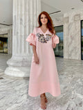 Stylish and feminine midi-kaftan dress is crafted with a glamorous beads and embroidery embellishments sprawled over.