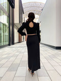 Maxi dress with puff sleeves and slit on the side.